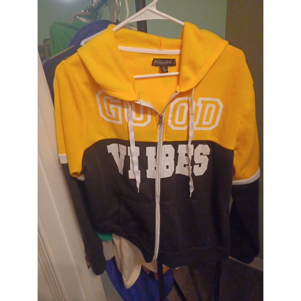 Rouge collection yellow and black zip-up hoodie features "GOOD VIBES" lettering
